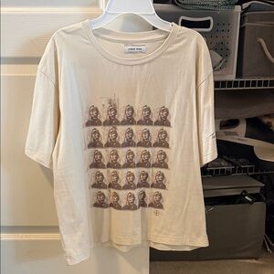 This Cream Tee with Brown Repeated Portrait Print